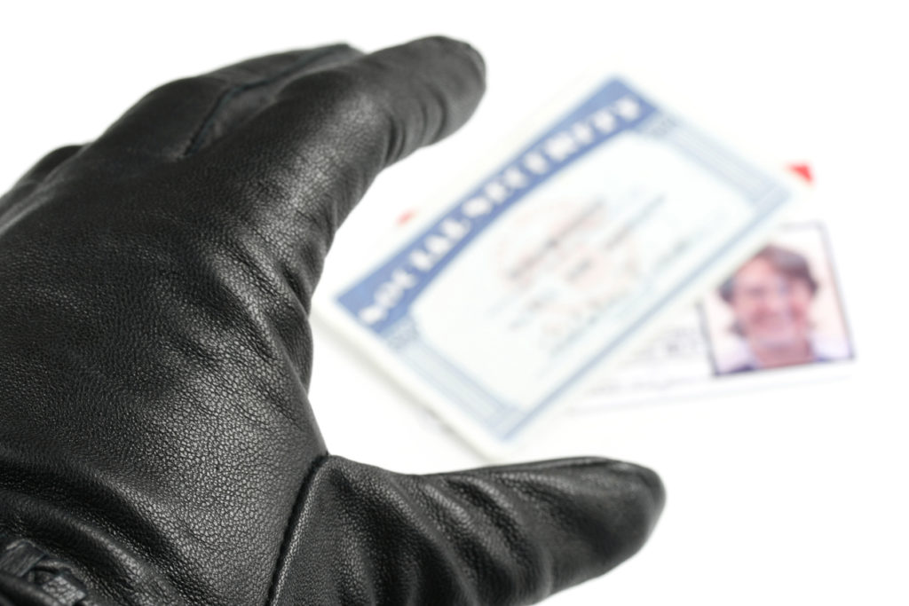 hand stealing id cards