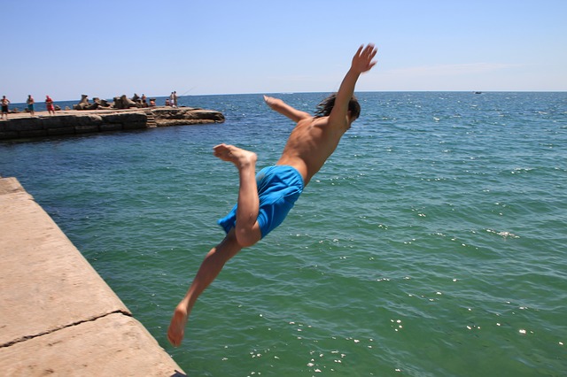 Man jumping into water