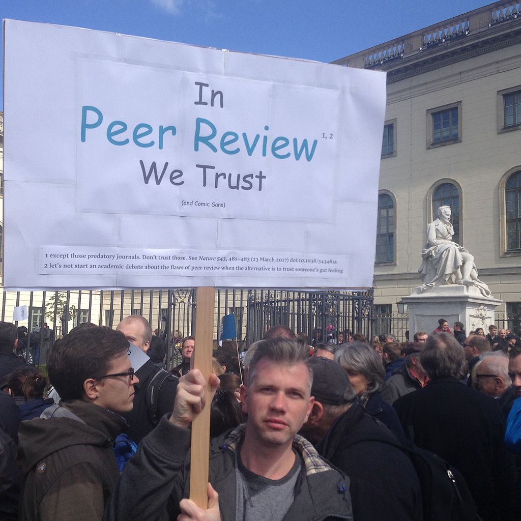 In peer review we trust protest sign