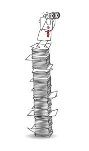 man on stack of papers