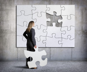 businesswoman and missing puzzle piece