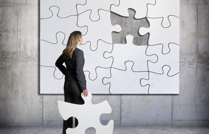 businesswoman and missing puzzle piece