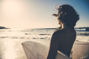 Surf girl looking into distance