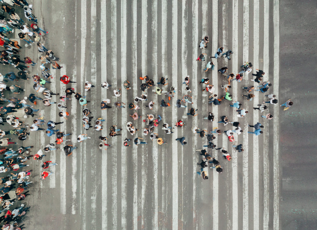 High Angle View Of People forming and arrow on the street