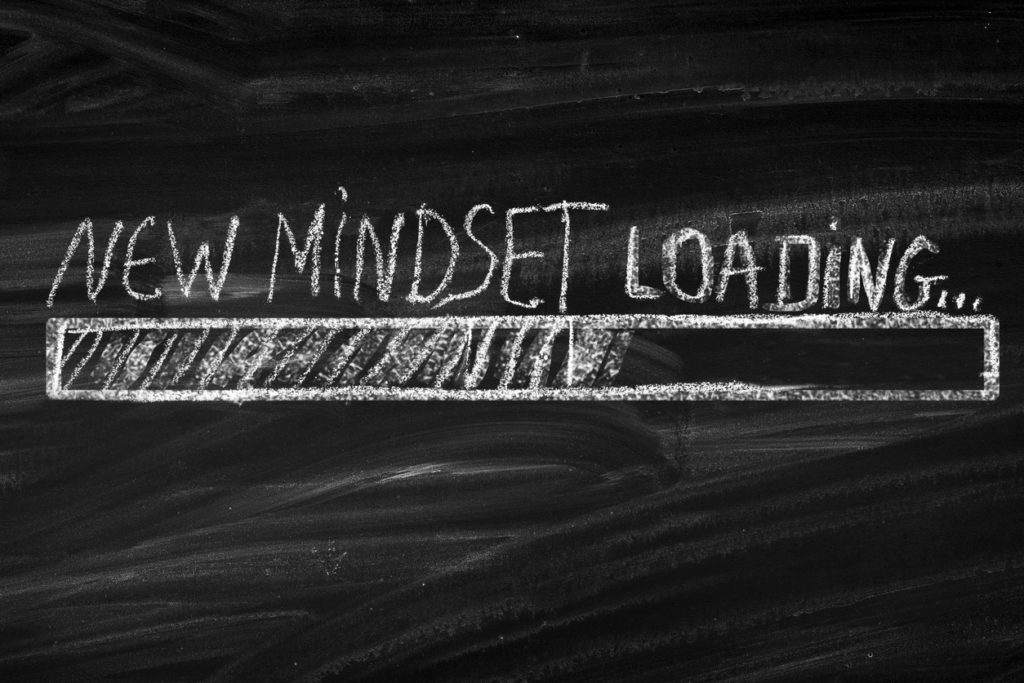 chalk drawing of status bar loading labeled "new mindset"