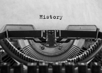 History typed on an vintage typewriter, old paper. close-up