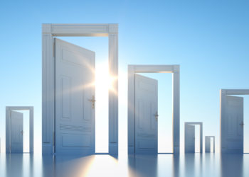 Group of open doors with blue sky and sun