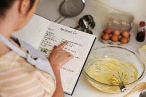 person using a recipe while baking