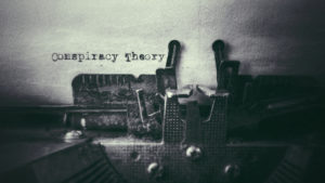 Conspiracy Theory text typed on paper with old typewriter