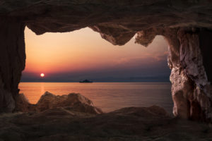View of the sunset from inside a cave