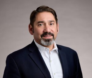 Profile headshot photo of Tony Alves, scholarly communications professional.