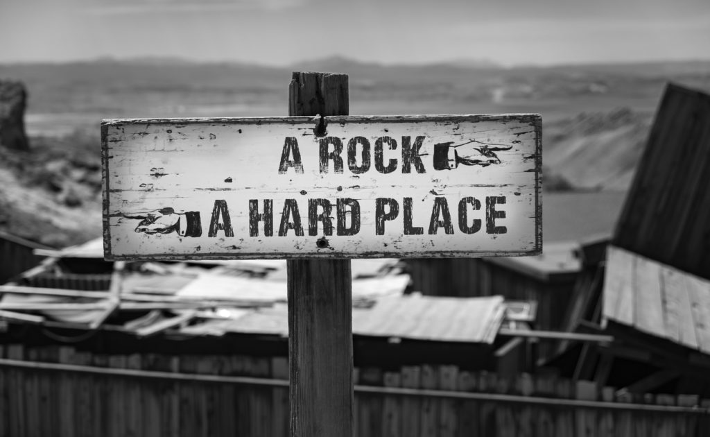 A Rock and A Hard Place Direction Sign