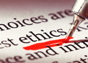 red pen underlining the word "ethics" in a document