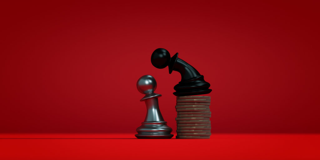 3d rendering of chess figures, one leaning over the other