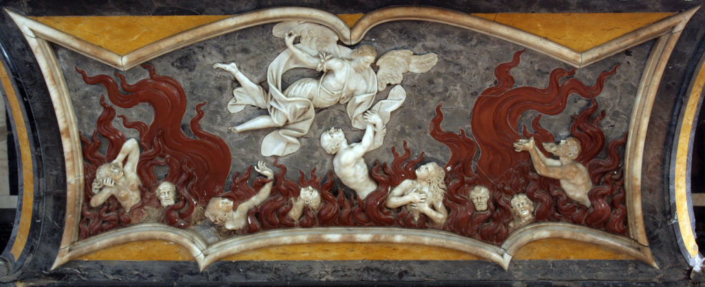 Old relief artwork depicting souls being purified in purgatory