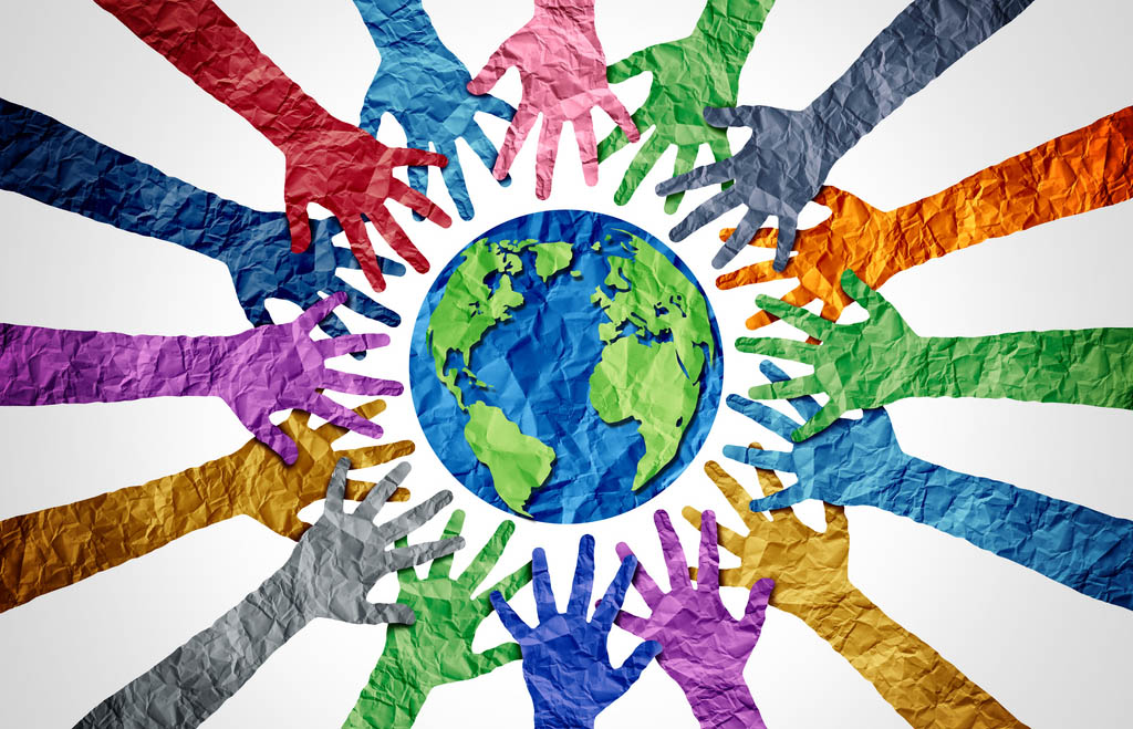 global diversity concept showing diverse hands holding together the planet.