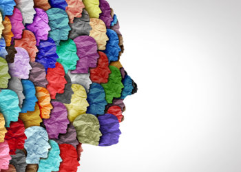 multi-colored silhouette of a face in profile made up of many smaller faces