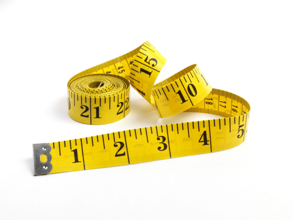 yellow tape measure isolated on white