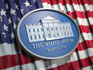 The White House Washington sign on flag of United States