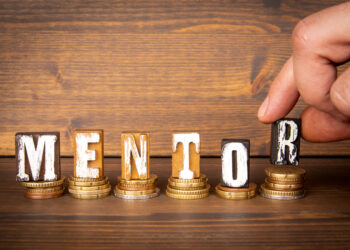 alphabet letter blocks spelling out the word "mentor"