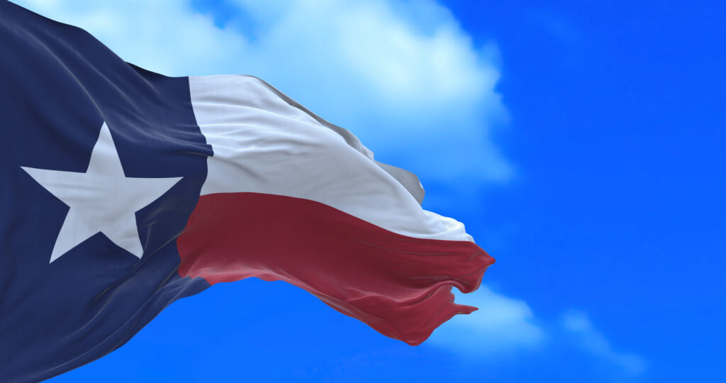 Flag of Texas against a blue sky