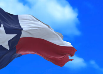 Flag of Texas against a blue sky