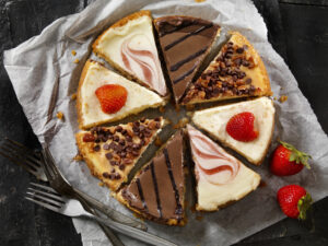 A plate with slices of various types of cheesecake