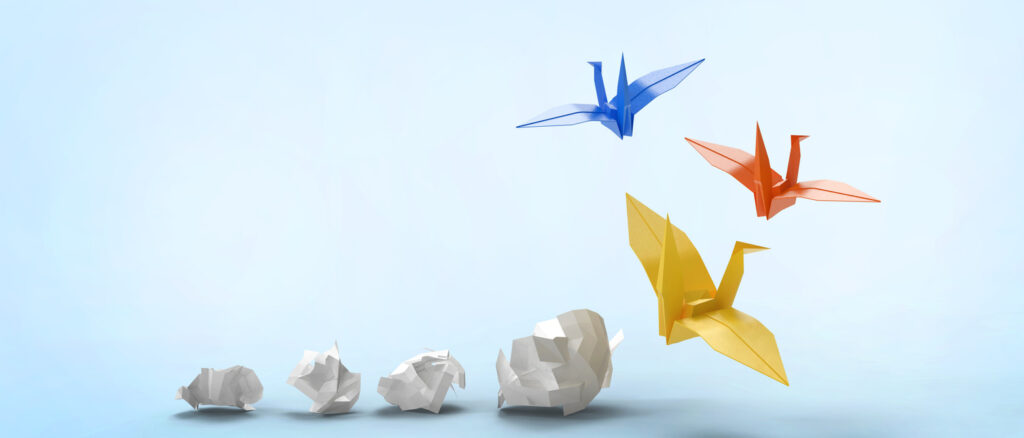plain paper transforming into origami cranes