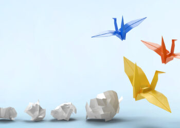 plain paper transforming into origami cranes