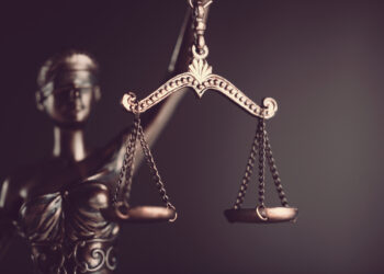 Statue of justice holding scales