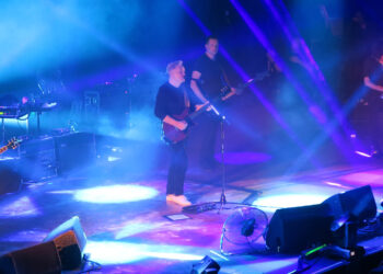 New Order band playing onstage