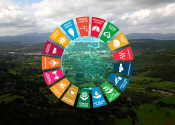 sustainable development goals symbols over a landscape photograph