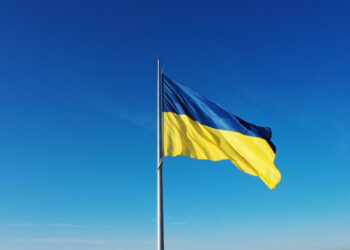 Ukranian flag against a blue sky