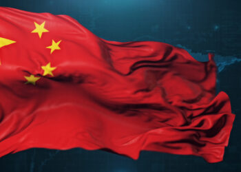 Flag of China on dark blue background.