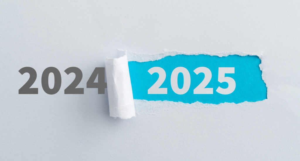 the numbers 2024 printed on paper, with a torn area next to it revealing underneath the numbers 2025