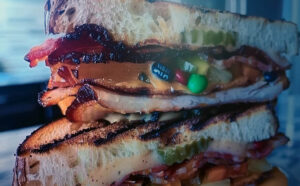 fake AI generated image of a turkey sandwich containing M&Ms