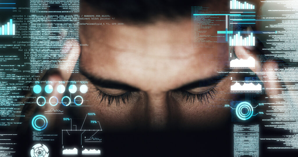 Image of a person's face showing frustrating and pain over data analysis, with digital images of data overlaying the photo.