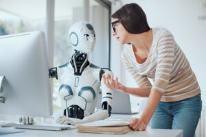 Woman having an argument with a robot in an office setting, the robot is operating a keyboard for a computer