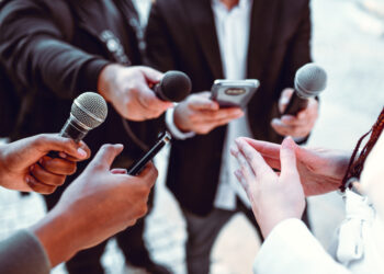 Female Leading Interview With Journalists Outside