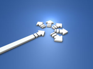 white arrow on a black background, at the arrow's end are several small arrows pointing off in different directions