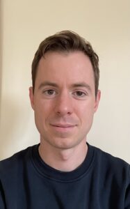 Headshot for George Cooper, a scholarly publisher and researcher.