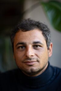 Professional headshot for Ilyas Saliba, researcher and thought leader
