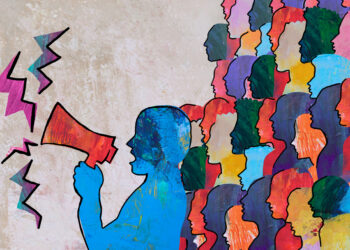 Person speaking holding megaphone with group of people protesting behind them. Decorative graphic representing freedom of speech and democratic communications.