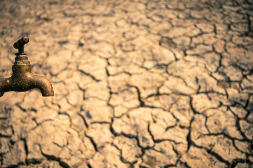 dried barren land with a closed, dry spigot