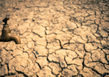 dried barren land with a closed spigot