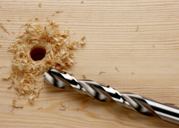 drill bit next to a recently drilled hole