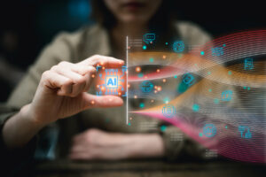 person in the background using their hands to manipulate a superimposed AI icon leading to a flow of various digital icons representing types of information