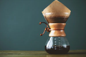 Pour over coffee being filtered as it enters a carafe