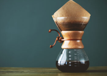 Pour over coffee being filtered as it enters a carafe
