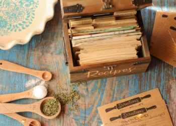 Vintage wooden recipe box trunk with natural recipe cards in rustic kitchen